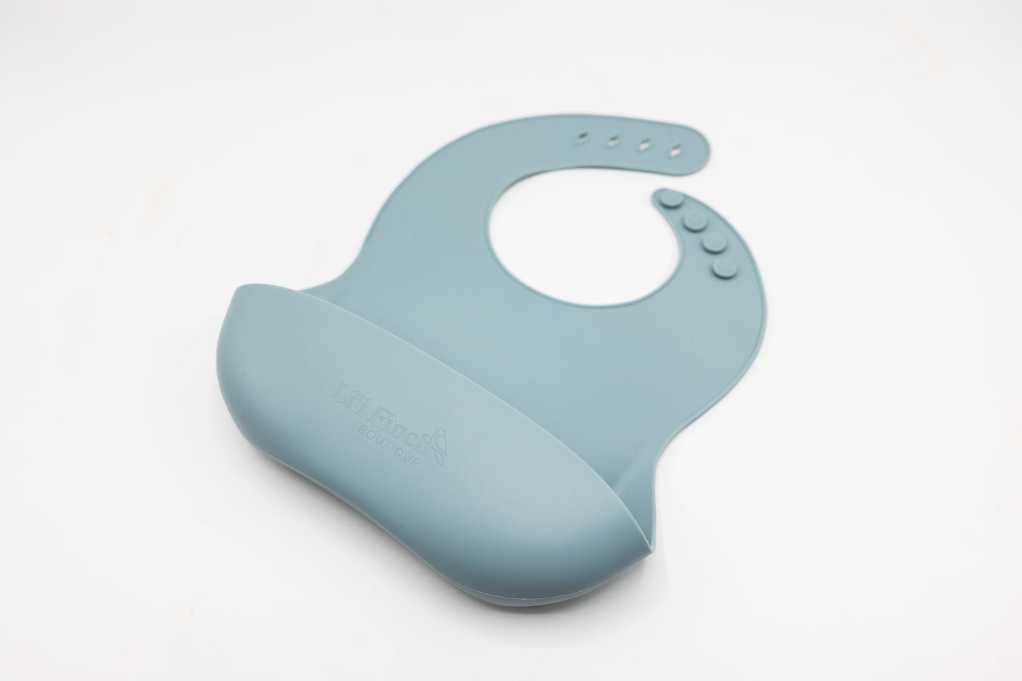 Button fastening behind the neck ensures a secure fit for the silicone bucket bib.