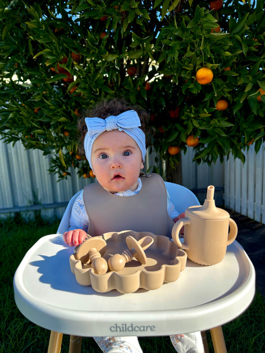aby learning to drink independently from a sippy cup with straw