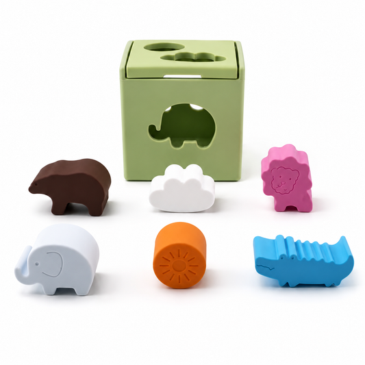 Set of colorful animal-shaped blocks with a green silicone box 