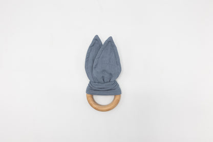 Dusty blue bunny ear teether with fabric ears and wooden teething ring