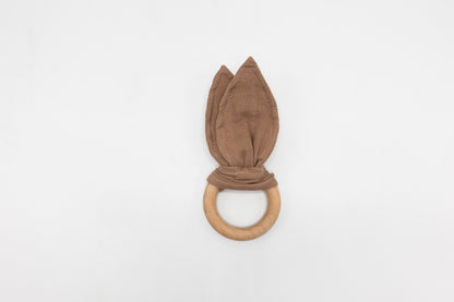 Brown bunny ear teether with fabric ears tied at base and round wooden ring