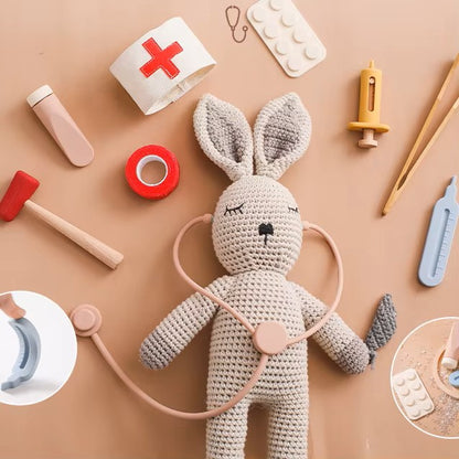 Crochet plush doctor bunny with stethoscope and red cross medical accessories