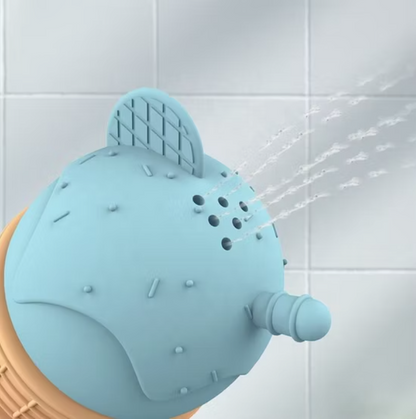 Blue ice cream bath toy with sprayer nozzle releasing water in a shower