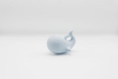 Blue whale bath toy with squeeze spout detail.