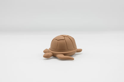 Brown turtle bath toy, molded shell and flippers.