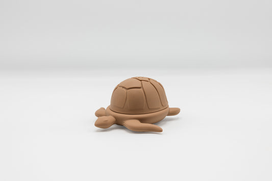 Brown turtle bath toy, molded shell and flippers.