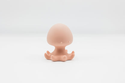 Pink octopus bath toy with molded tentacles.