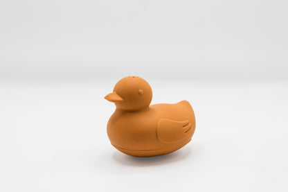 Orange rubber duck bath toy with molded beak and wing detail.