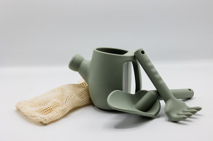 Light green plastic watering can set with rake and spade, plus mesh glove