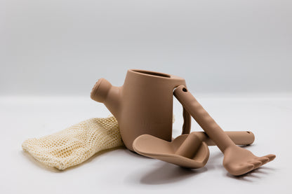 Brown plastic watering can set with rake and spade, plus mesh glove