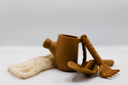 Tan plastic watering can set with rake and spade, plus mesh glove