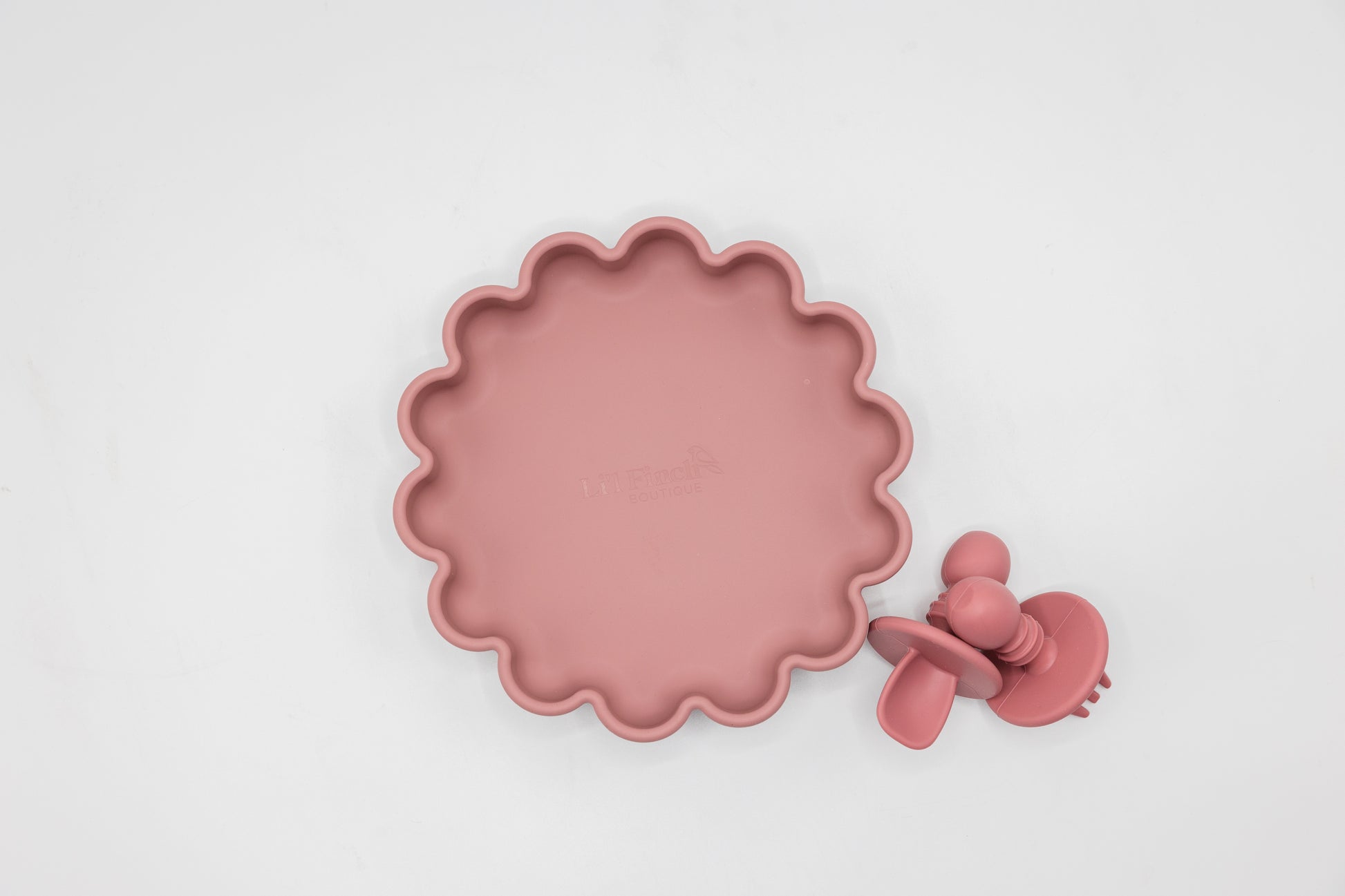 Colourful silicone suction plate with food, making mealtime fun and mess-free.