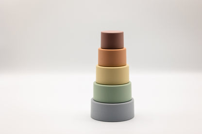 Stacking cups set with nested dark gray, green, beige, and brown cups