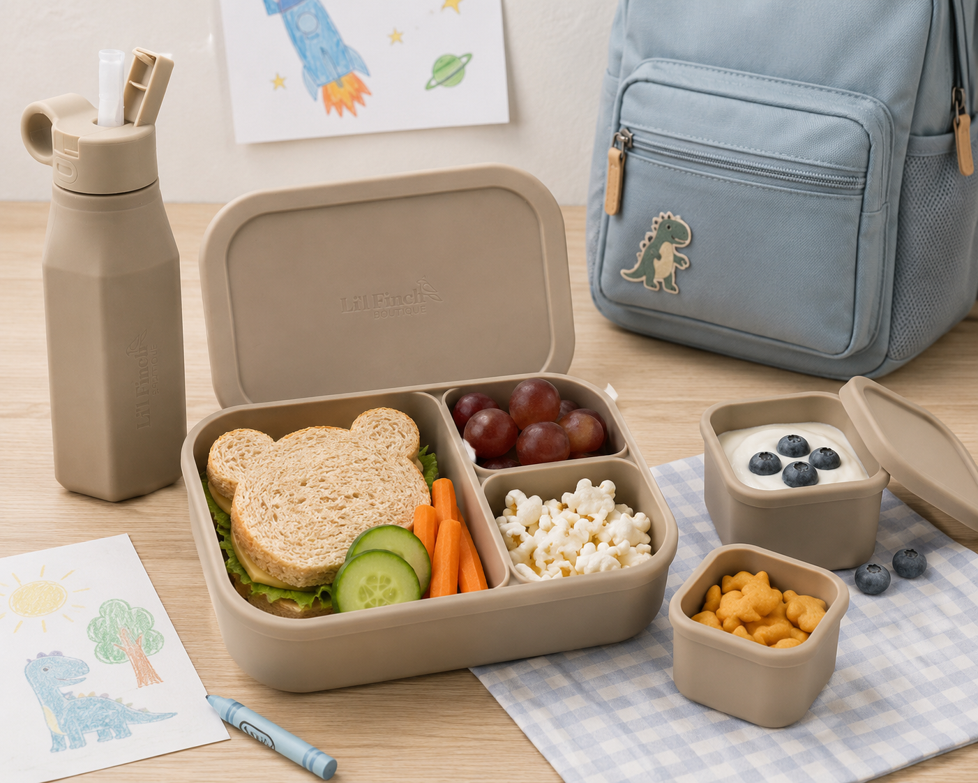 Children's bento lunchbox with compartments, water bottle, and snacks boxes in almond colour
