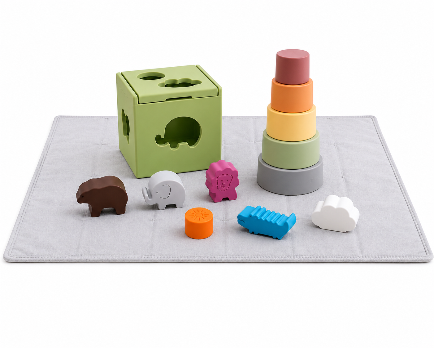 Colorful children's toys including a shape sorter, stacking cups, and various animal blocks on a grey play mat