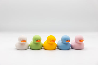 5 squeeze duck bath toys: white, green, yellow, blue, pink