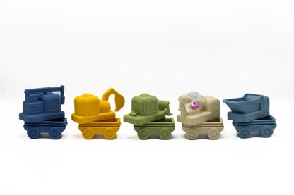 5-pack construction bath toys with blue, yellow, green, and beige vehicle trucks on display