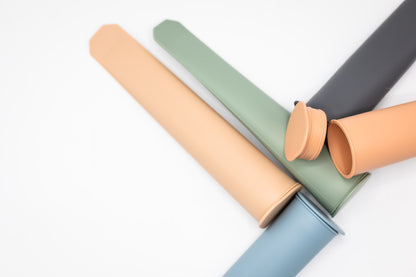 Popsicle mold tubes in green and peach colors, five-pack