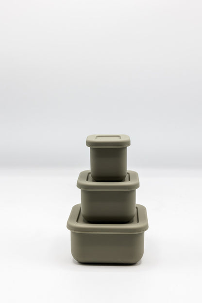 Stacked silicone snack boxes with lids, olive green color