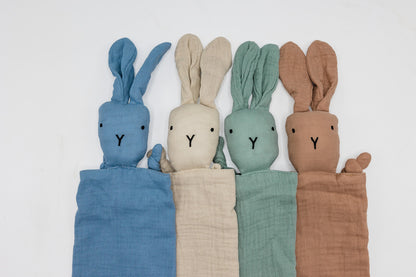 Colorful snuggle bunny comforter set with stitched bunny heads in blue, cream, green, brown