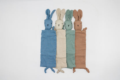 Snuggle bunny comforter set with stitched bunny heads in blue, cream, green, tan, brown